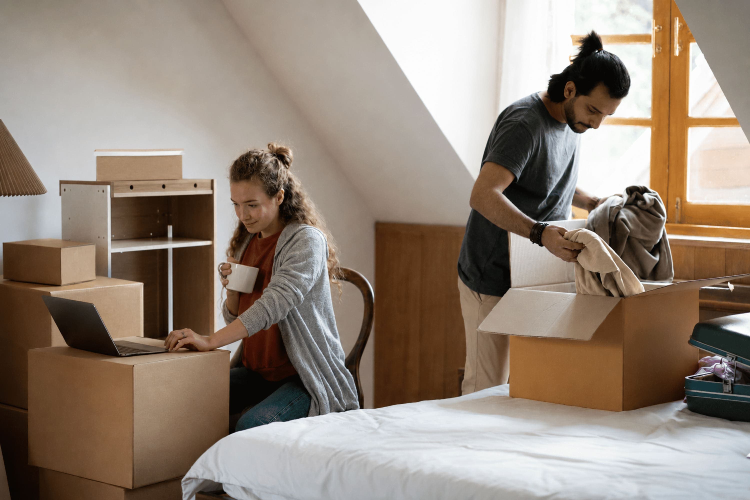 Couple packing furniture for a move