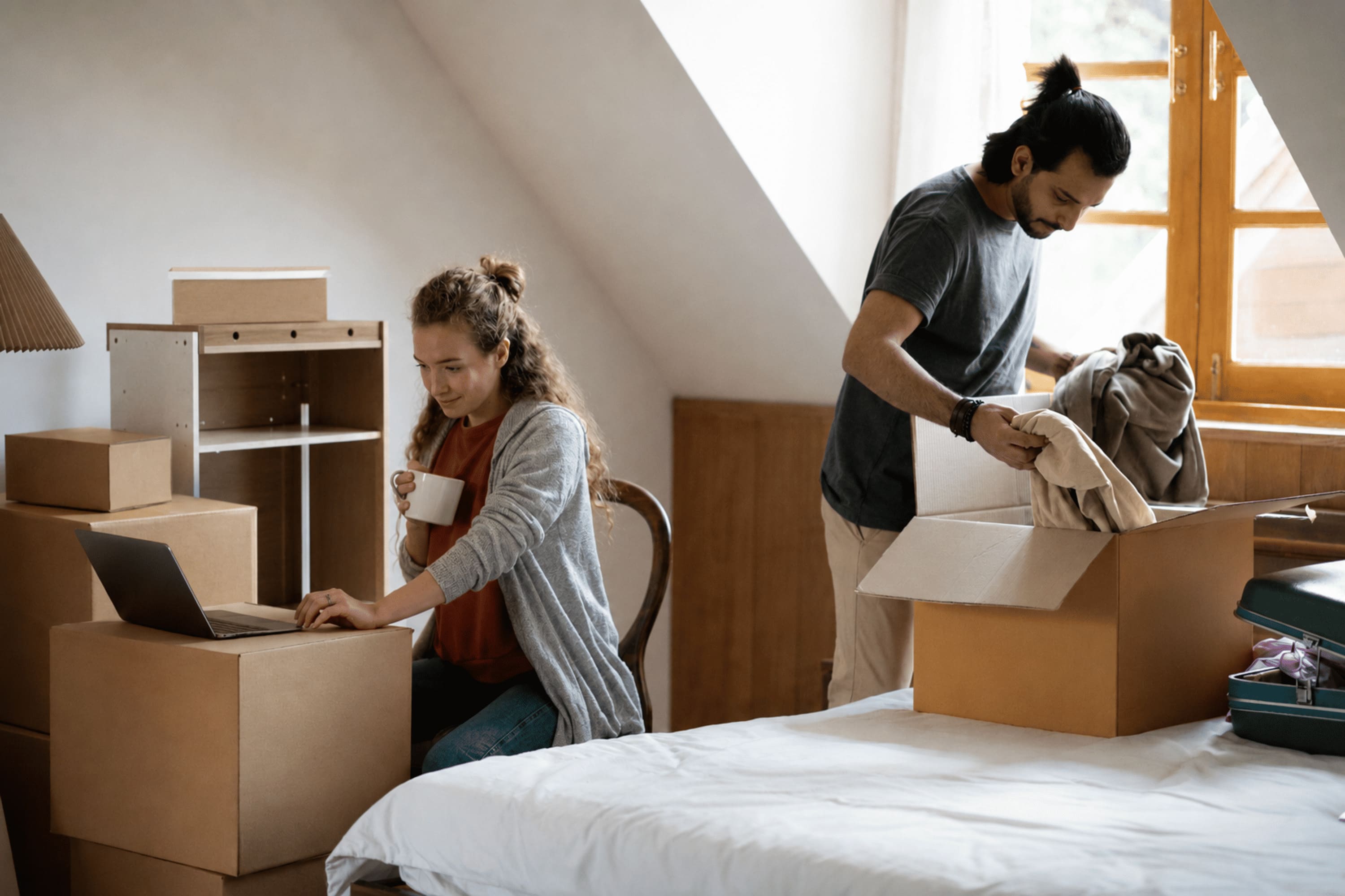 Couple packing furniture for a move